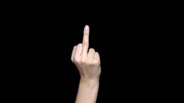 Hand sign showing middle finger in rude way meaning fuck off, isolated on black background. Human hand sign showing middle finger, negative expression — Stock Photo, Image