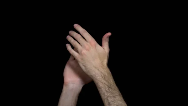 Hands applauding isolated on a black background. Clapping hands over a black background — Stock Photo, Image