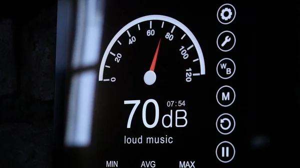 Close-up of sound level meter screen in decibels. Modern electronic sound meter around