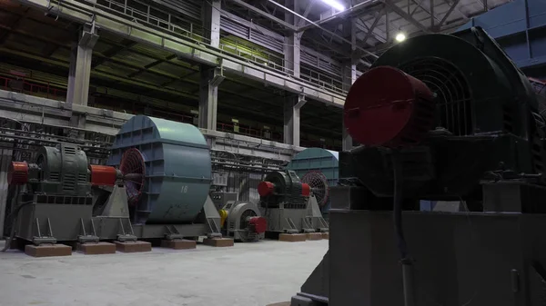 Copper crushing plant. Ball mills in large room of shop at mining enterprise. Crushing equipment at large mining plants