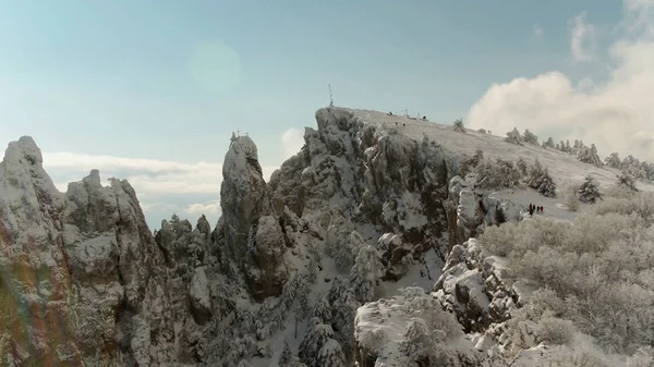 Top of mountain under snow and blue sky. Shot. Winter panorama of mountain. Top view of the high hill under the sky — Stock Photo, Image