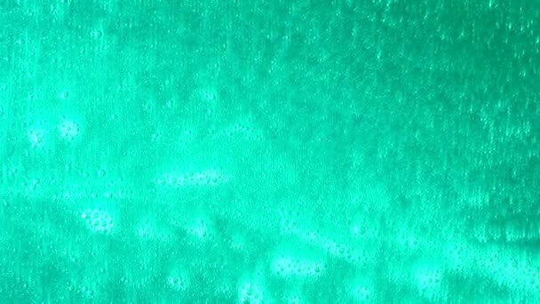 Gros plan sur la texture du gel turquoise. Texture colorée . — Video