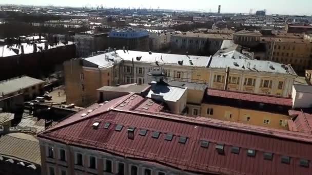 Top view of roofs of old town houses. Panorama of old town with colorful pastel houses standing by river on sunny clear day — Stock Video