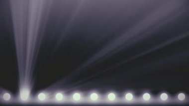 Yanıp sönen parlak sahne ışıkları. Spot ışıkları duvar sahne animasyon