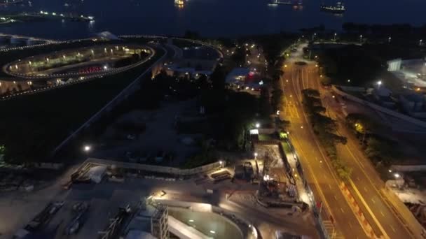 Singapore noite Mooving aéreo para o porto. Atingido. Porto comercial de Singapura — Vídeo de Stock