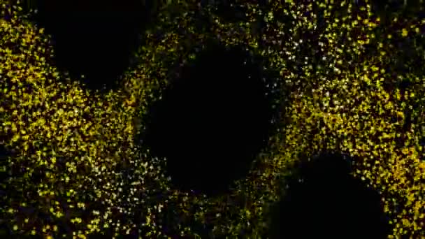 Animation abstraite de belles particules jaunes scintillantes volantes sur fond noir. Étincelles colorées .