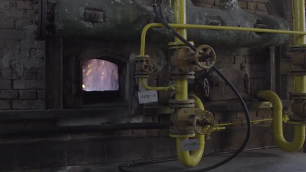 Open iron stove in boiler room. Fire inside the furnace at the plant — Stock Video