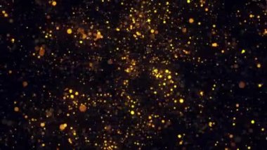 Parıldayan altın parçacıkların soyut animasyonu siyah bir arka plan üzerinde döner. Görüntü. Renkli animasyon