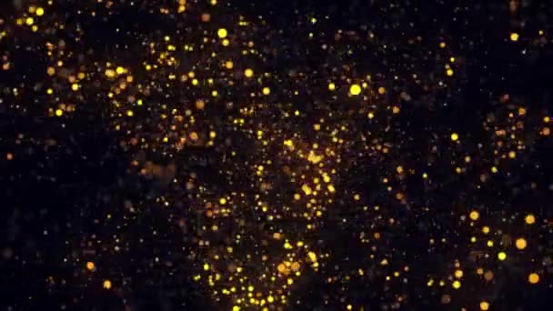 Animazione astratta di scintillanti particelle d'oro rotazione su uno sfondo nero. Un filmato. Animazione colorata — Video Stock