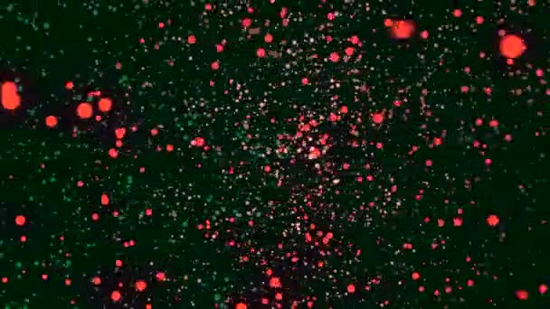 Abstraktní animace třpytivých barevných částic pohybu na zeleném pozadí. Záběry. Barevná animace — Stock video