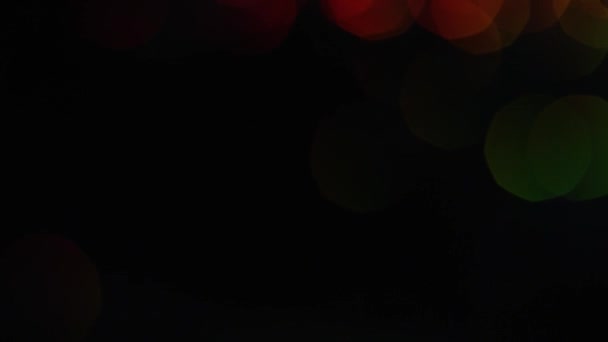 Taches multicolores de bokeh brillant sur fond noir. Images d'archives. Coloré brillant brillant grand bokeh magnifiquement briller sur fond noir 