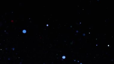 Siyah arka plan üzerinde renk parlak glitter Splash. Stok görüntüleri. Siyah izole arka plan üzerinde sıçrama ve saçılma sırasında parlak ve ışıltılı renkli parçacıklar