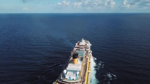 Beautiful seascape with a big cruise ship in the Black sea in a sunny summer day, travel and luxury concept. Stock. White giant yacht sailing under blue, cloudy sky. — Stock Video