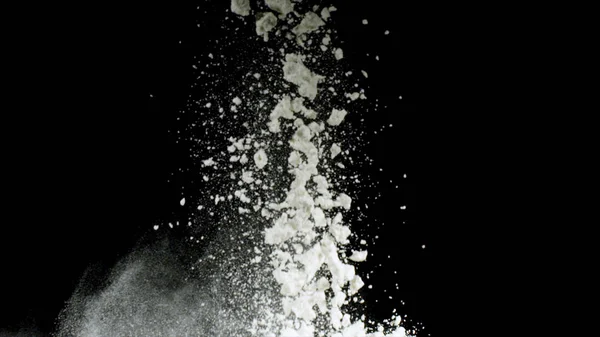 Splash of white powder isolated on black background. Stock footage. Close up for white abstract snow being thrown up. — Stock Photo, Image