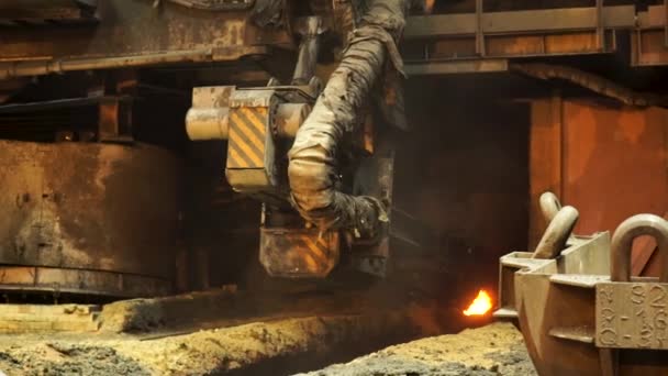 Electric furnace for smelting liquid steel at the metallurgical plant. Stock footage. Close up for the working machine at the factory. — Stock Video