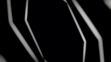 Abstract endless movement of geometrical figures, one by one, forming tunnel on black background, seamless loop. Animation. White glowing octagons rotating.