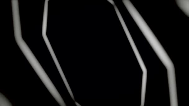 기하학적 인물의 추상적 인 끝없는 움직임, 하나 하나, 검은 배경에 터널을 형성, 원활한 루프. 애니메이션. 회전하는 흰색 빛나는 팔각형. — 비디오