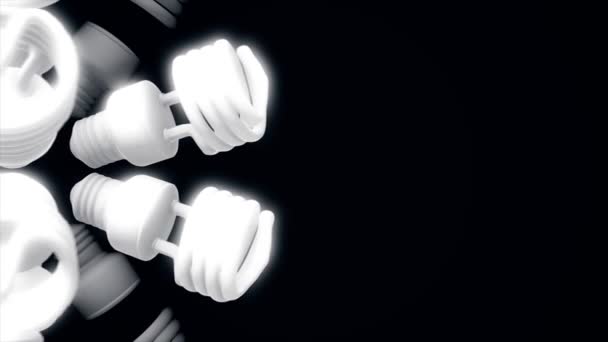 Close up for white energy saving lamps rotating isolated on black background. Animation. Monochrome abstract motion of shining halogen bulbs, seamless loop. — Stock Video