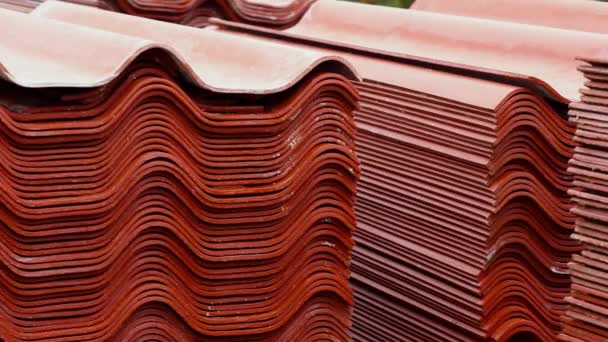 Stack red roof tiles, raw material for industrial of construction. Stock footage. Warehouse with red roof tiles — Stock Footage Stack red roof tiles, raw material for industrial of construction. Stock footage. Warehouse with red roof tiles Royalty Free Stock Footage
