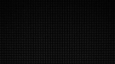 Soyut spot ışıkları siyah noktalı yüzeyi soldan sağa aydınlatıyor, tek renkli. Animasyon. Beyaz ışık huzmesi, küçük parçacıklarla karanlık duvara doğru yönelir..