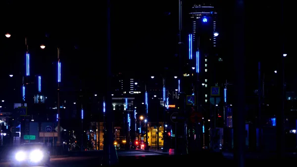 Neon lights on lights of night city. Stock footage. Night track of modern city is equipped with beautiful neon lights like in city of future