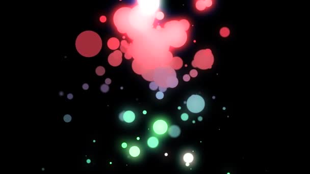Hermosa abstracción de partículas de colores brillantes grandes y pequeñas girando y cayendo sobre el fondo negro. Animación. Deliciosa animación de partículas flotantes multicolores — Vídeos de Stock