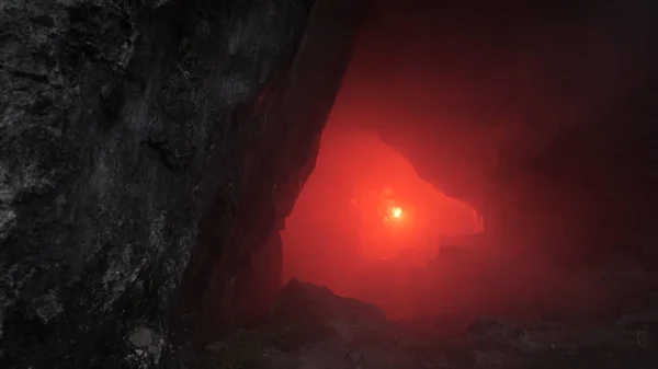 Traveler in dark cave. Stock footage. Man with red torch goes through narrow tunnels of dark cave. Dangerous and fascinating exploration of passages in rock cave