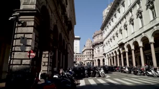 Street filled with motorcycles. Action. Beautiful street with architectural old buildings of european city is filled with motorcycles. Public parking for motorbikes are available — ストック動画