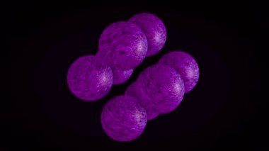 3d animasyon. Siyah bir arka plan üzerinde dönen ve parıldayan çok renkli küçük kürelerin soyut animasyonu. Animasyon. Değişen yüzeylerle renkli topların animasyonu