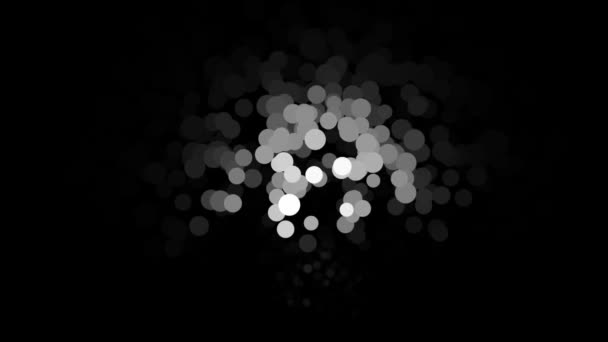 Infinitos pequenos círculos lindos de cor branca iluminada por uma chama lanterna, loop sem costura. Animação. Monocromático voando partículas redondas movendo-se caoticamente sobre fundo preto . — Vídeo de Stock