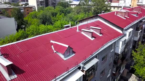 Top view of red roof of multi-storey residential building. Stock footage. Top view of red roof of multi-storey residential building — Stock Footage Top view of red roof of multi-storey residential building. Stock footage. Top view of red roof of multi-storey residential building Royalty Free Stock Footage