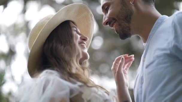 Close-up of newlyweds smiling and caressing. Action. Lovely young couple in love glow with happiness together. Newlyweds smile at each other on their honeymoon — Stock Video