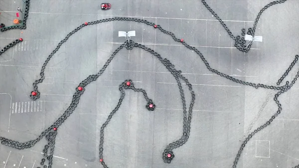 Aerial drone view on racing go-kart track, motorsport concept. Media. Sportsmen participating in the competition race and driving small red karts. — Stock Photo, Image