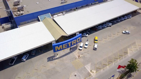 Top view of large blue shop with parking. Clip. Large wholesale store called Metro. Center of wholesale trade in large store Metro