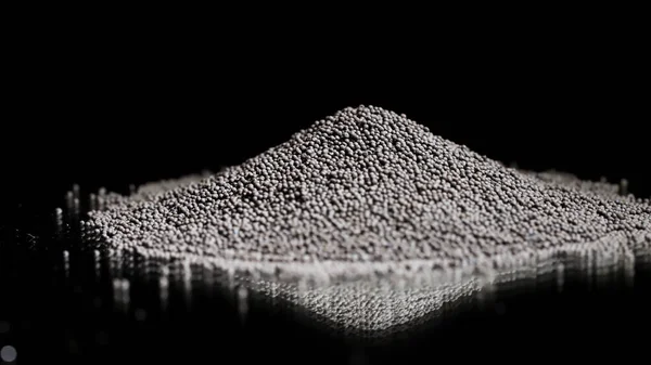 Pile of rocks isolated on black background. Stock footage. Close up of tiny black pieces of gravel lying on a flat reflecting surface, concept of construction materials quality control. — Stock Photo, Image
