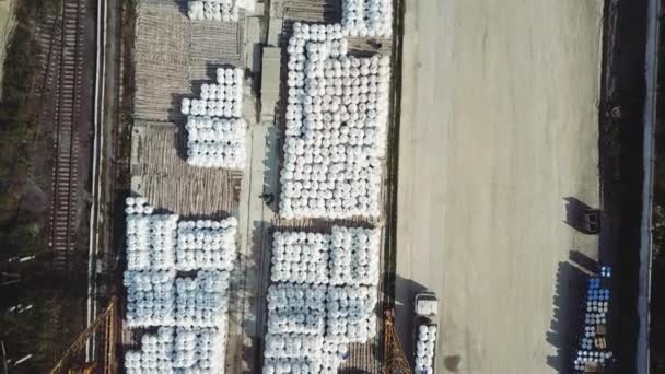 Aerial top view of building materials warehouse. Stock footage. Large storage of construction materials in industrial city zone from above. — Stock Video