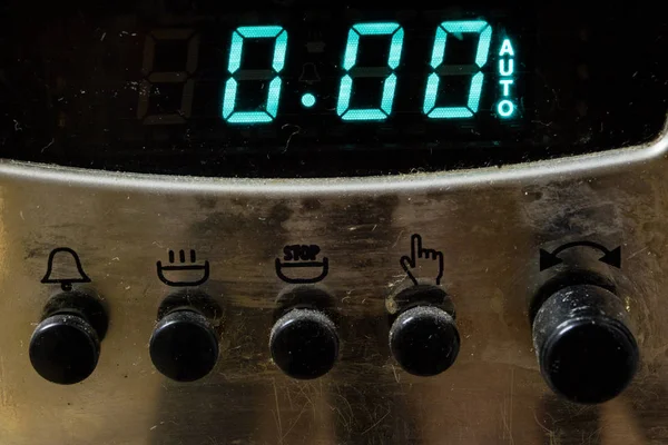 An old dirty gas kitchen. Device for preparing dishes in the kitchen. Dark background.