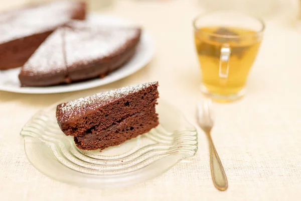 Prepared dessert in a family home. Family meeting at the kitchen table. Light background.