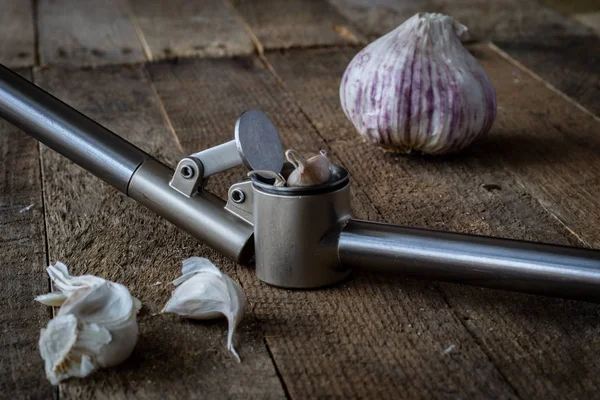 Garlic Vegetable Press Wooden Kitchen Table Dark Background — Stock Photo, Image