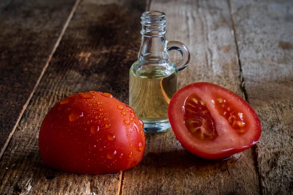 Italian tasty food, olive oil, white cheese and tomatoes. Black background.