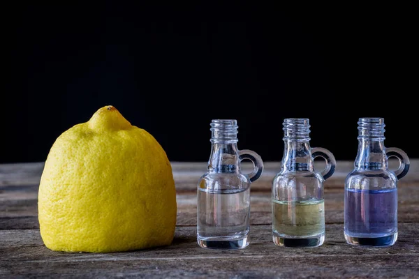 oil bottle with fruits and vegetables on old table