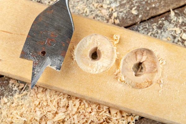 Drilling with a vane drill in chipboard. Carpentry work in a car — Stock Photo, Image