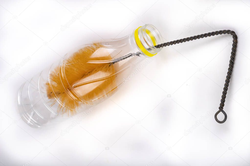 Brush for washing bottles in the household. Cleaning work in the