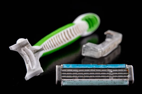 An old used hair shaver. Personal use accessories on a dark tabl — Stock Photo, Image