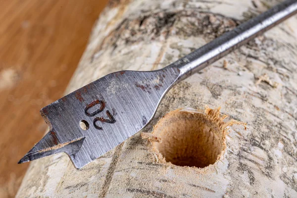 Drilling with a steel drill in wood. — Stock Photo, Image