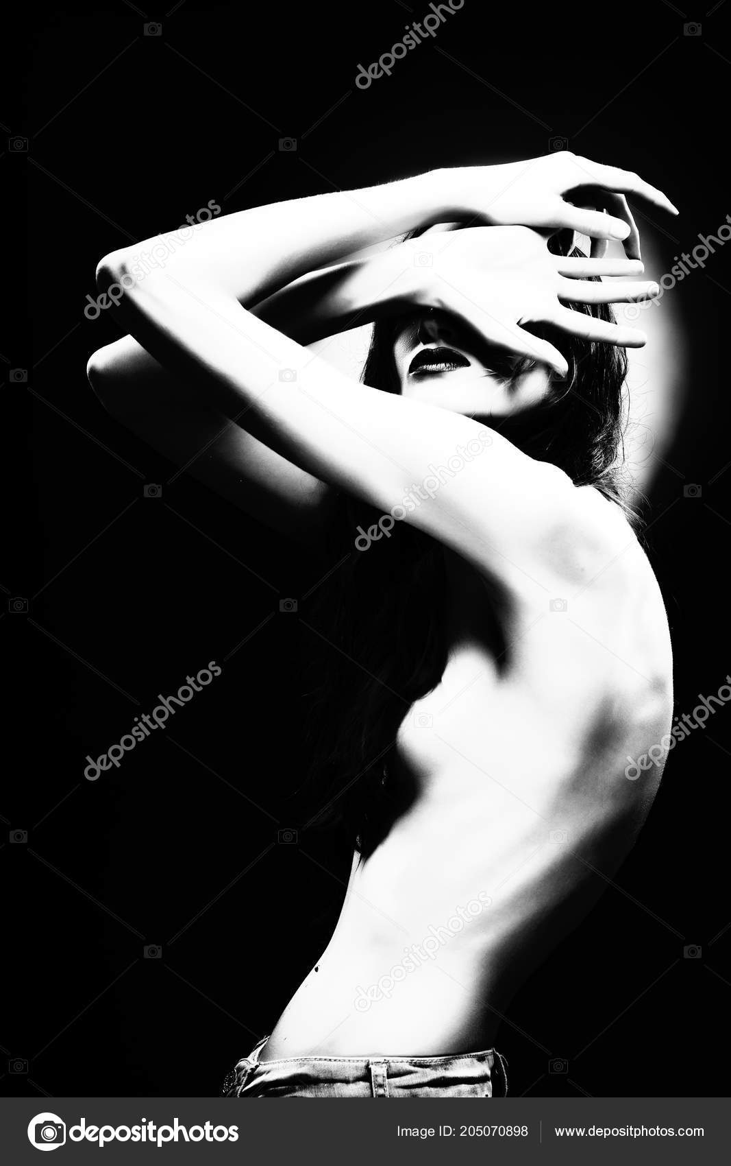 Beautiful Slim Athletic Topless Girl Model Holds In Her Hands And Covers  Her Naked Breast With A Large Steel Bolt Fastener. Healthy Skin. Copy  Space. Advertising, Commercial And Conceptual Design. Stock Photo