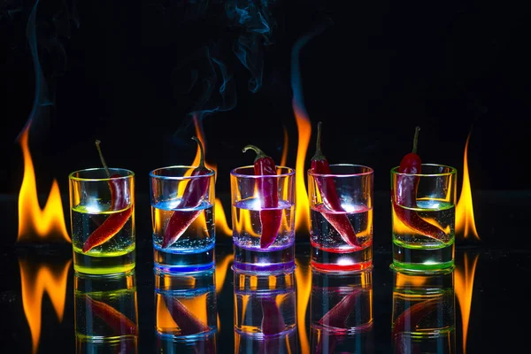 Five Multicolored Shot Glasses Full Drink Red Chili Peppers Lying — Stock Photo, Image