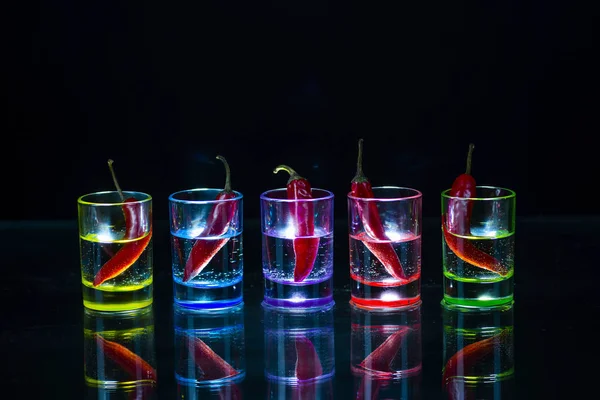 Five Multicolored Shot Glasses Full Drink Red Chili Peppers Lying — Stock Photo, Image