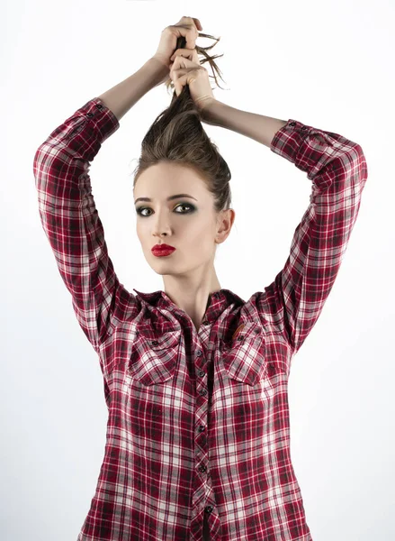Beautiful emotional girl model with red lips make-up, wearing a