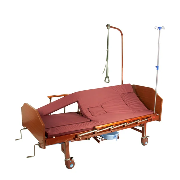 Medical brown metal semi-automatic bed on wheels with burgundy mattress isolated on white